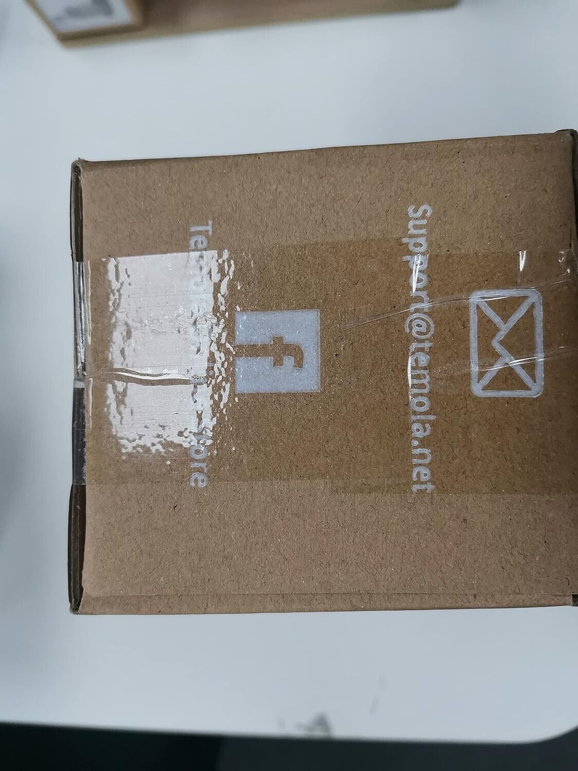 Temola car vacuum cleaner packaging box with logo and contact information for customer support