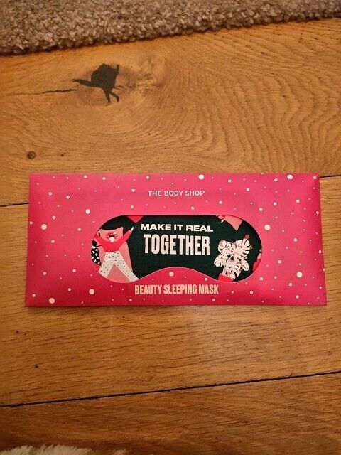 The Body Shop beauty sleeping mask packaging with a festive design and a vibrant pink background