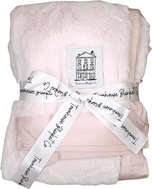 Soft pink baby chenille blanket by Townhouse Blanket Co wrapped in a stylish ribbon