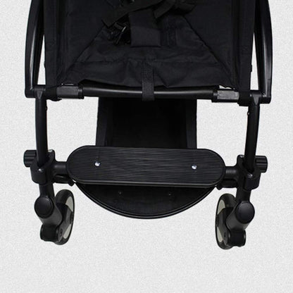 Universal stroller pedal in black for added convenience and support while using a stroller