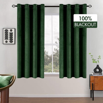 Luxurious green velvet blackout curtains providing 100 percent light blocking for a serene atmosphere