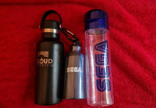 Assorted video game water bottles including black, silver, and clear designs for gamers