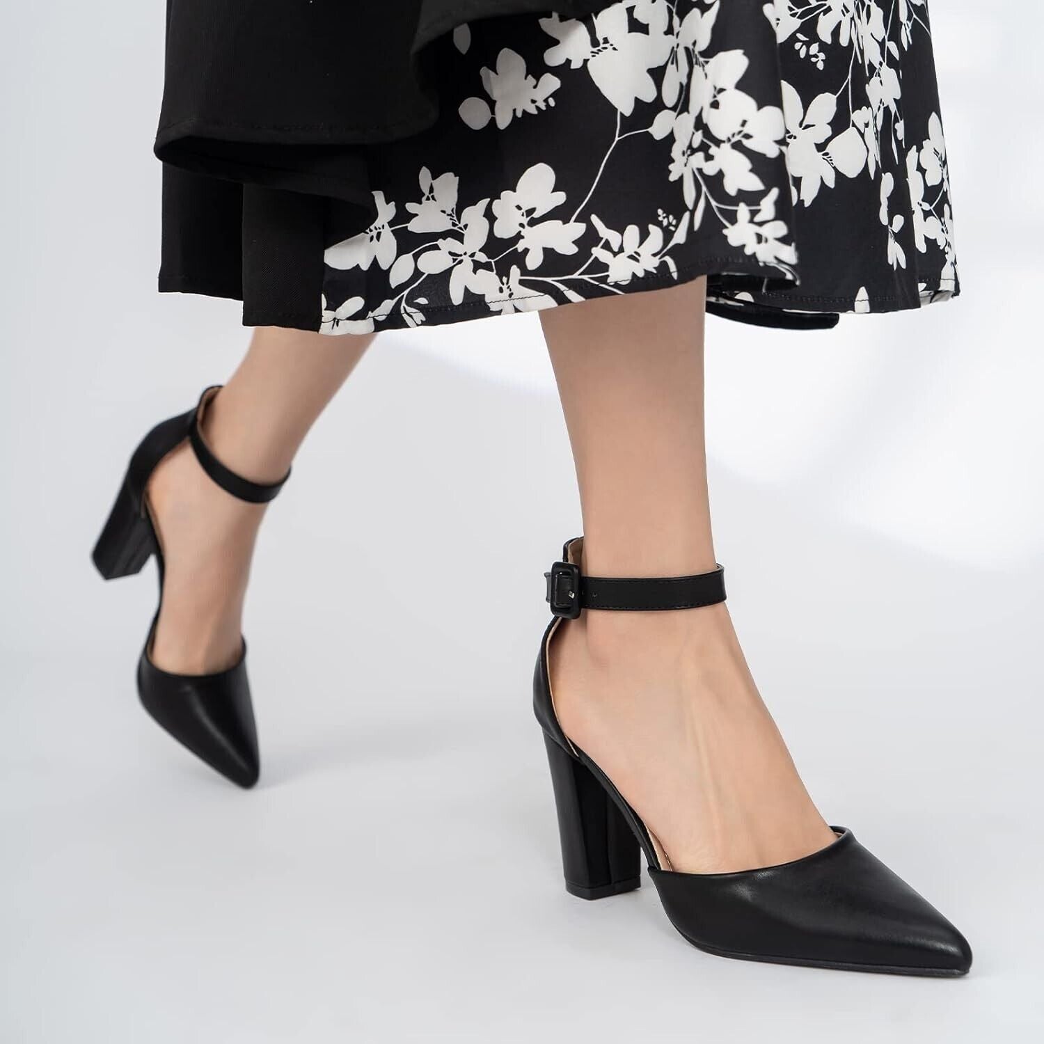 Stylish womens black pointed toe court shoes with ankle strap, perfect for formal occasions