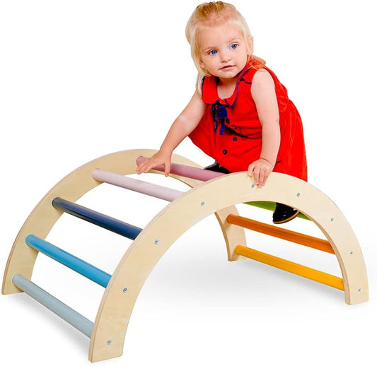Child playing on a colourful wooden arched climbing frame designed for safe, fun development