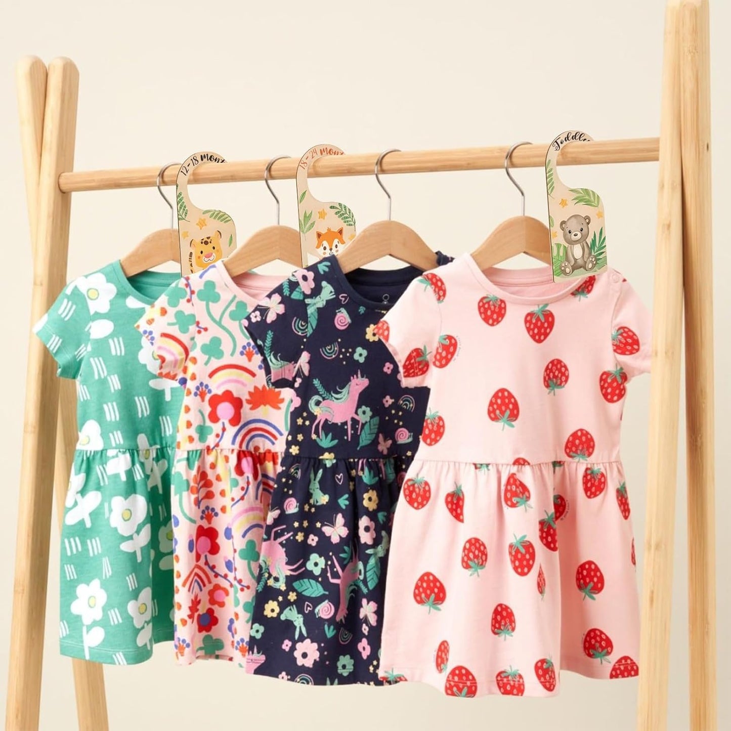 Vinuwu wooden baby wardrobe dividers with colourful dresses hanging on display for easy organisation